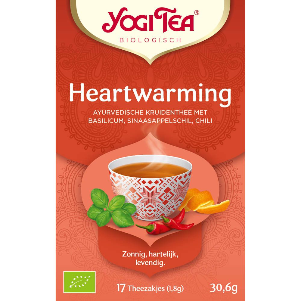Rode Yogi Tea® doos. Opschrift: Heartwarming. 17 theezakjes. Afbeelding van een kop thee met ingrediënten.