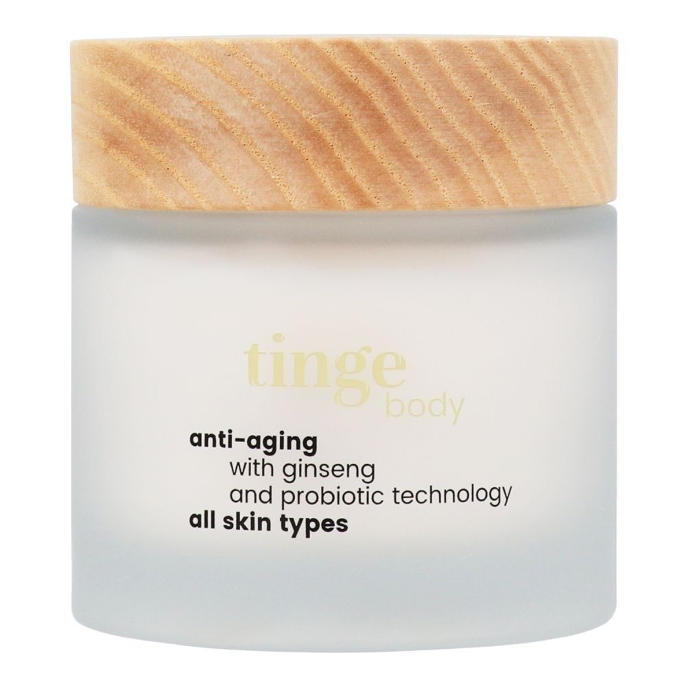 Tinge Bodylotion Anti-Aging in een matglazen pot met houten deksel.