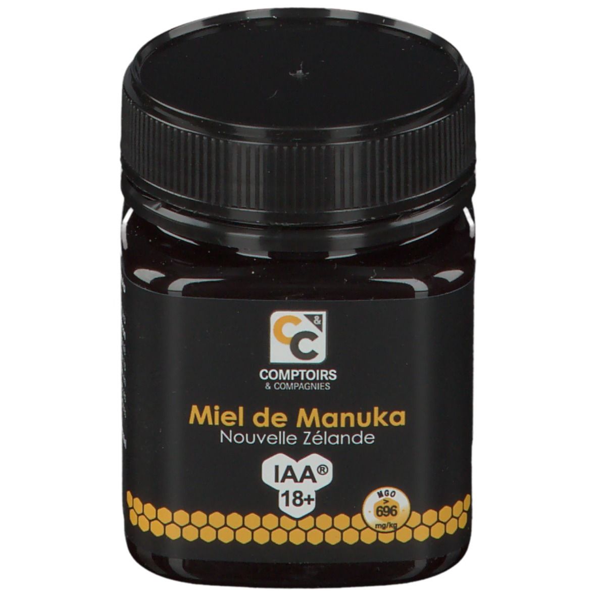 Zwarte pot honing. Opschrift: Comptoirs & Compagnies, Miel de Manuka Nouvelle Zélande, IAA 18+.