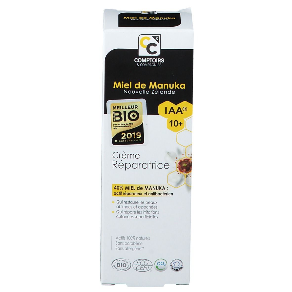 Productverpakking. Zwart-wit, Tekst: Miel de Manuka, Crème Réparatrice, IAA 10+, bio-label.