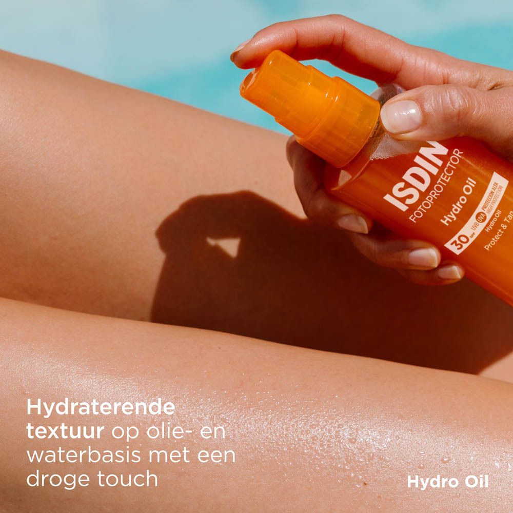 ISDIN HydroOil SPF 30. Texture huileuse. Flacon avec vaporisateur. Bouchon orange. Inscription.