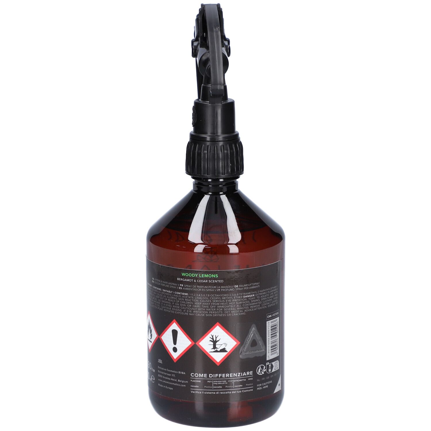Vue arrière d'un flacon pulvérisateur brun avec tête noire. Autocollant avec symboles d'avertissement et texte.