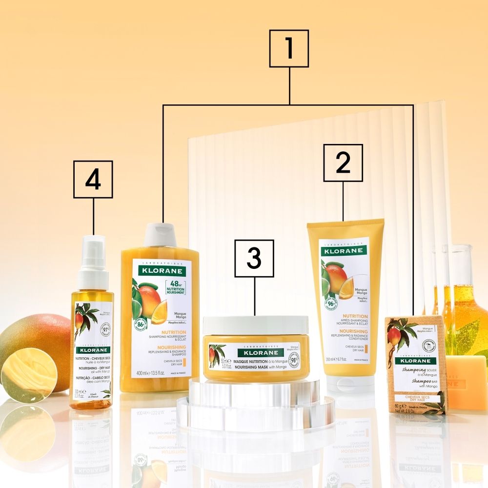 KLORANE Baume à la Mangue, tube avec motif de fruit et fruit de mangue.