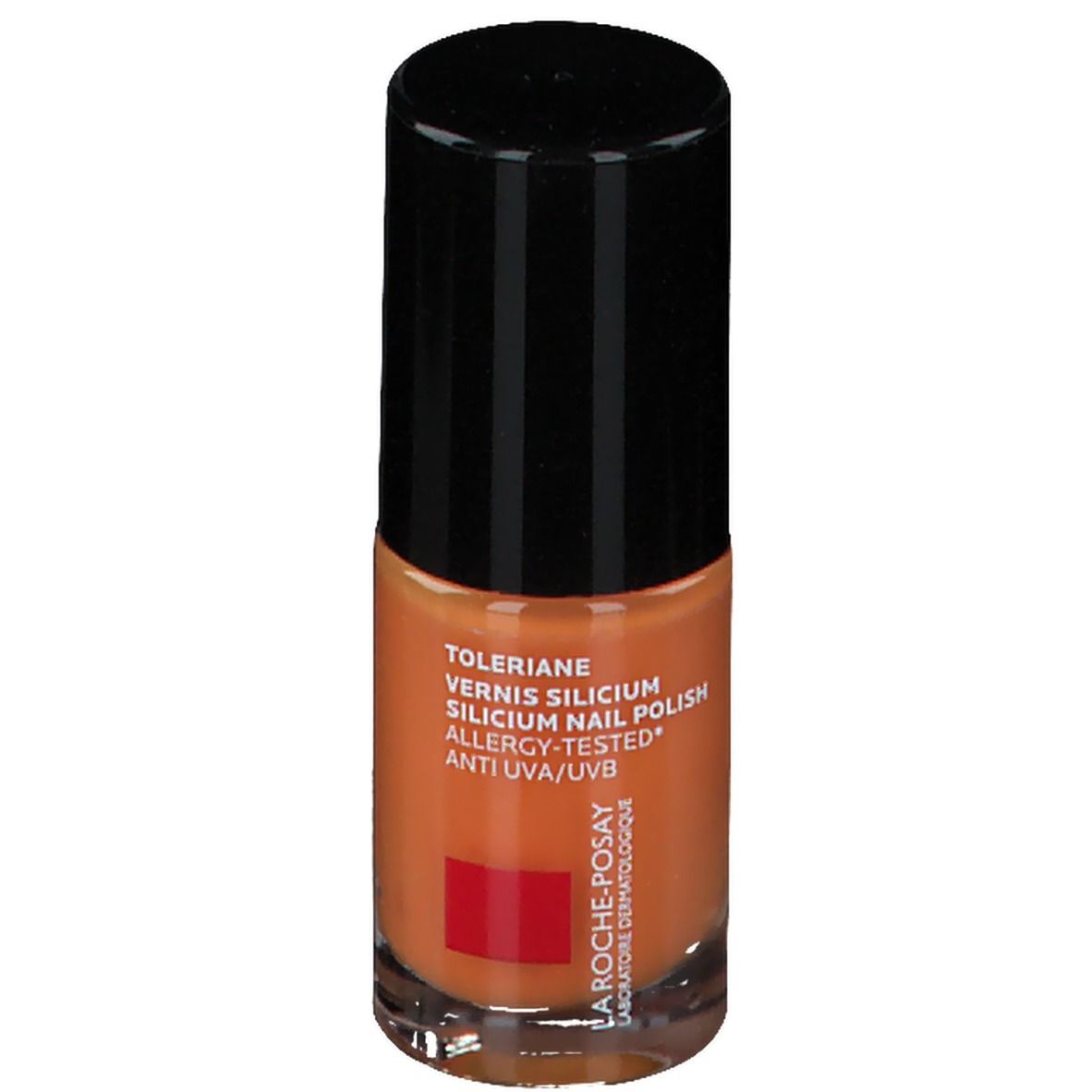 Oranje nagellakfles. Zwarte dop. Tekst: Toleriane, Vernis Silicium, Allergy-Tested, Anti UVA/UVB. Rood logo.