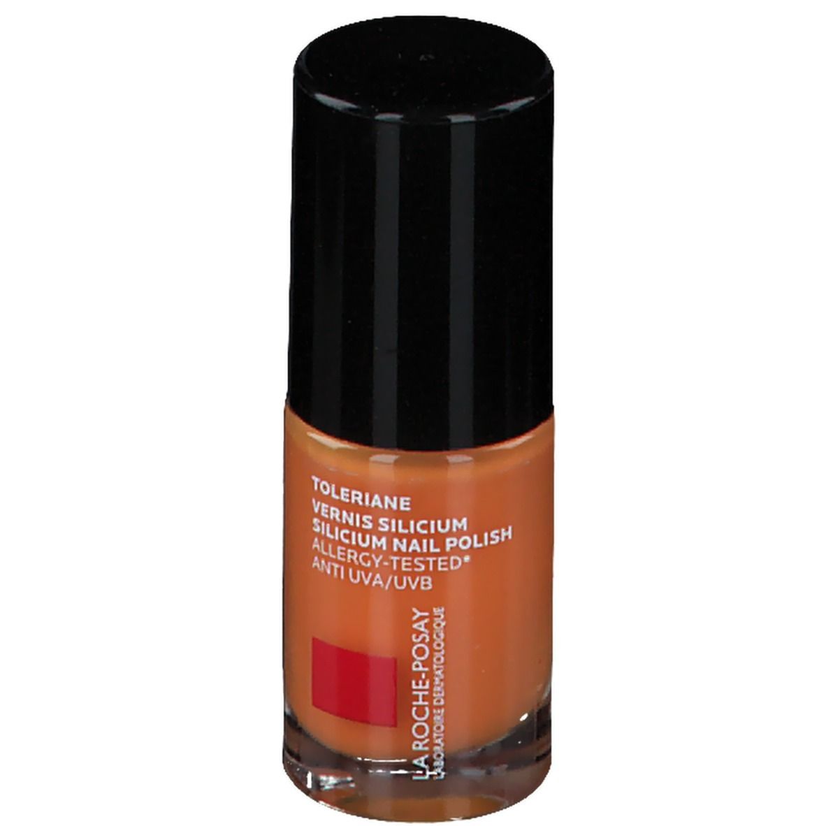 Oranje nagellakfles. Zwarte dop. Tekst: Toleriane, Vernis Silicium, Allergy-Tested, Anti UVA/UVB. Rood logo.