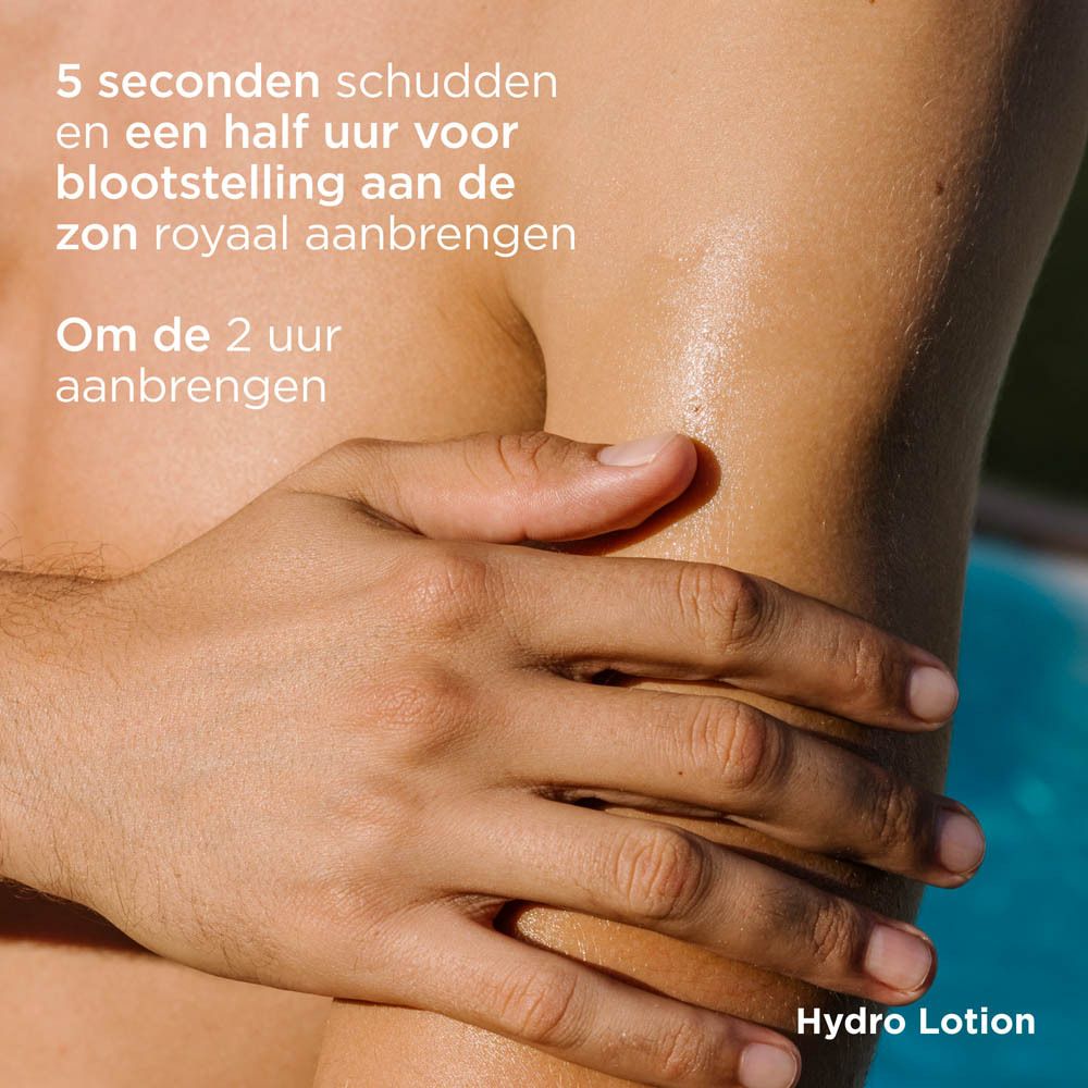 Homme appliquant ISDIN Hydro Lotion SPF 50+ sur le bras. Flacon jaune-vert. Texte.