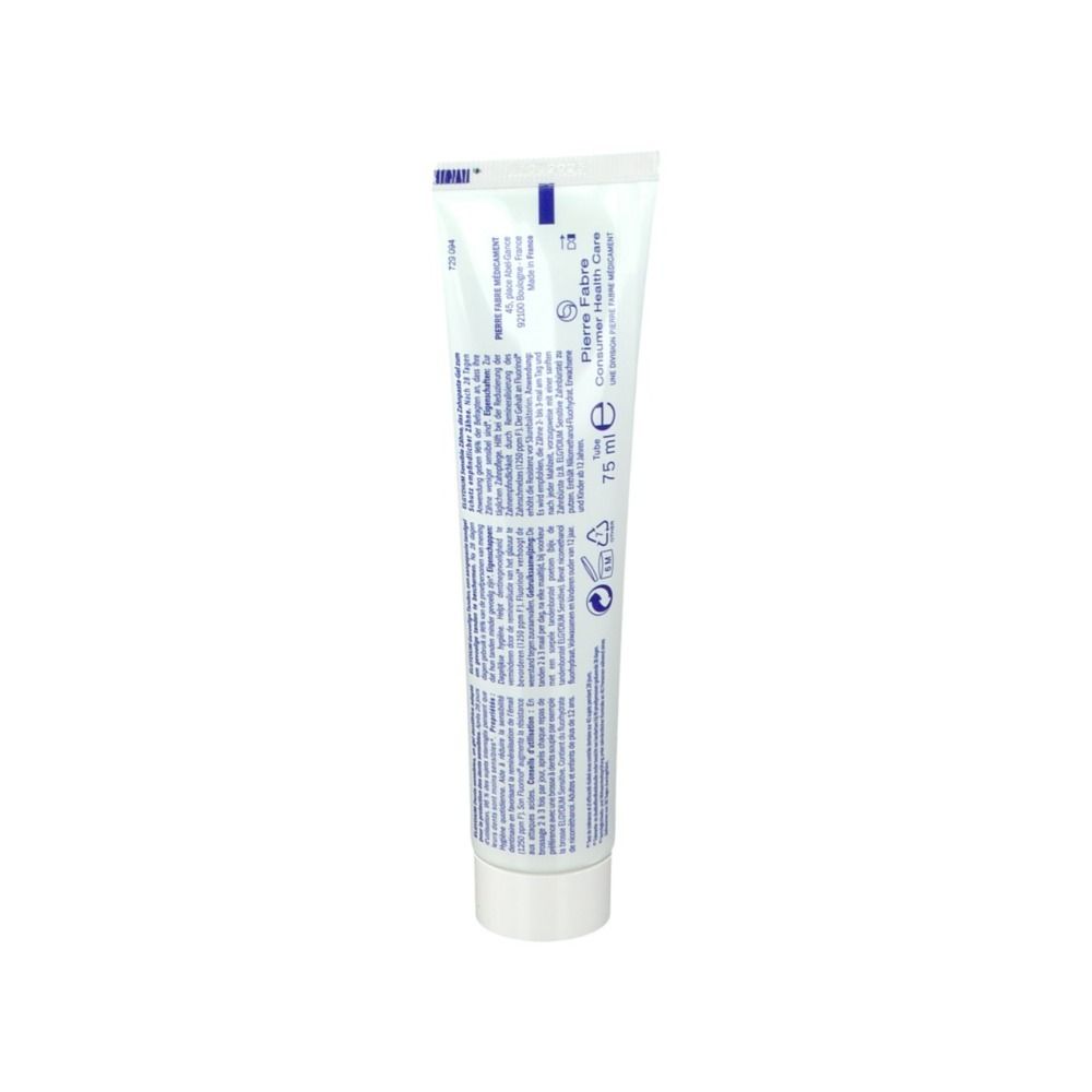 Dos du tube de gel dentifrice. Blanc avec texte bleu. Texte: Pierre Fabre, 75 ml.