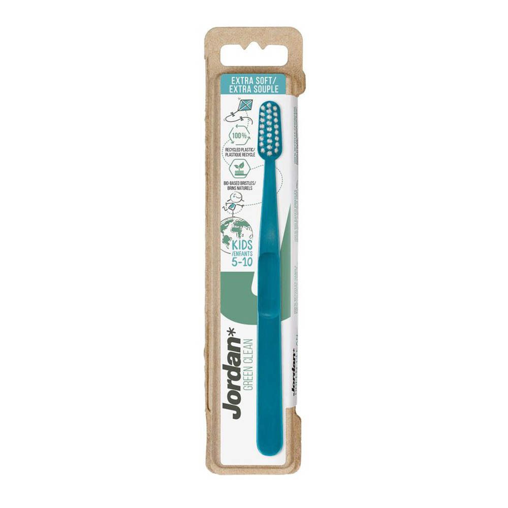 Brosse à dents bleue dans son emballage. Tête de brosse à poils blancs. Marque Jordan Green Clean. Pour enfants 5-10.