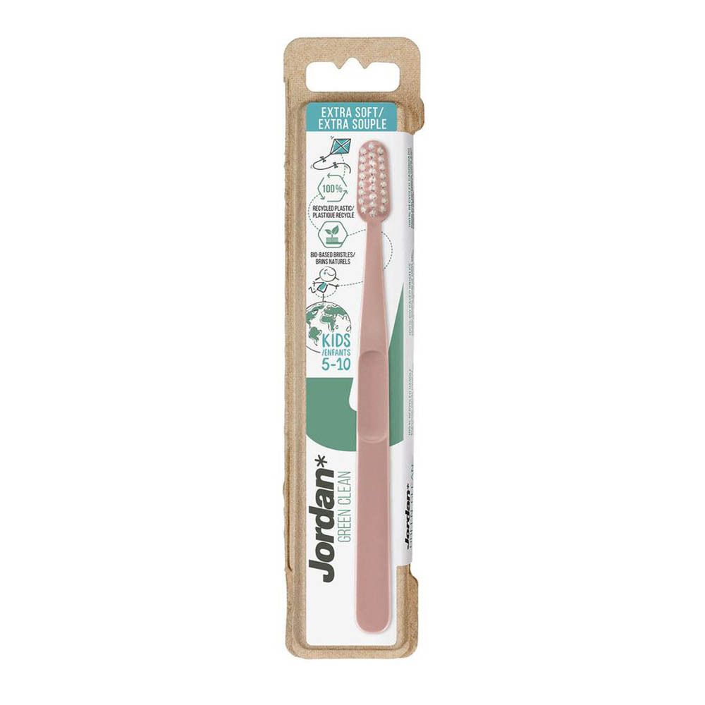 Brosse à dents rose dans son emballage. Tête de brosse à poils blancs. Marque Jordan Green Clean. Pour enfants 5-10.