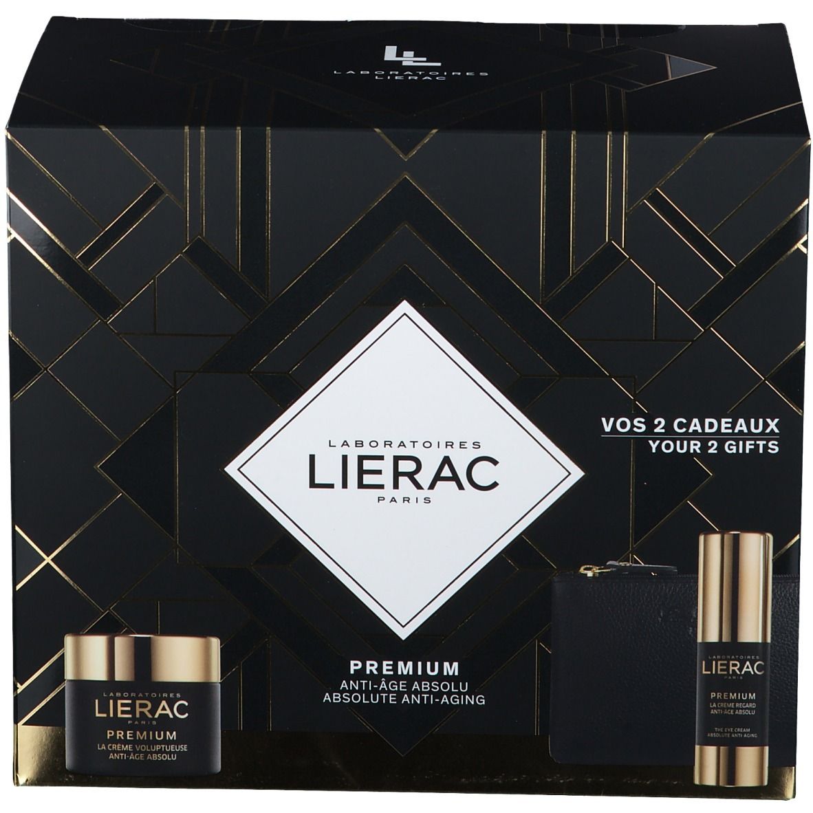 Geschenkset met cosmetica. Zwarte verpakking met gouden accenten. Bevat crème, serum en een kleine tas.