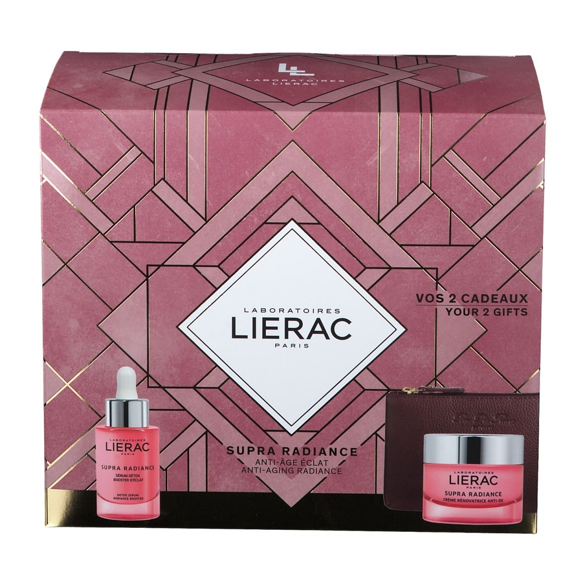Geschenkset met serum, crème en toilettas. Roze verpakking met logo en productnamen. Zichtbare teksten.
