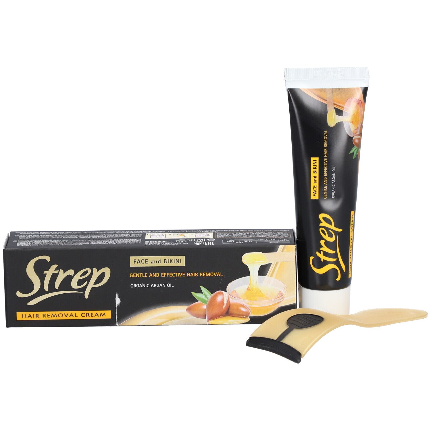 Ensemble de produits. Comprend un tube de crème dépilatoire, une boîte et une spatule. Logo STREP visible.