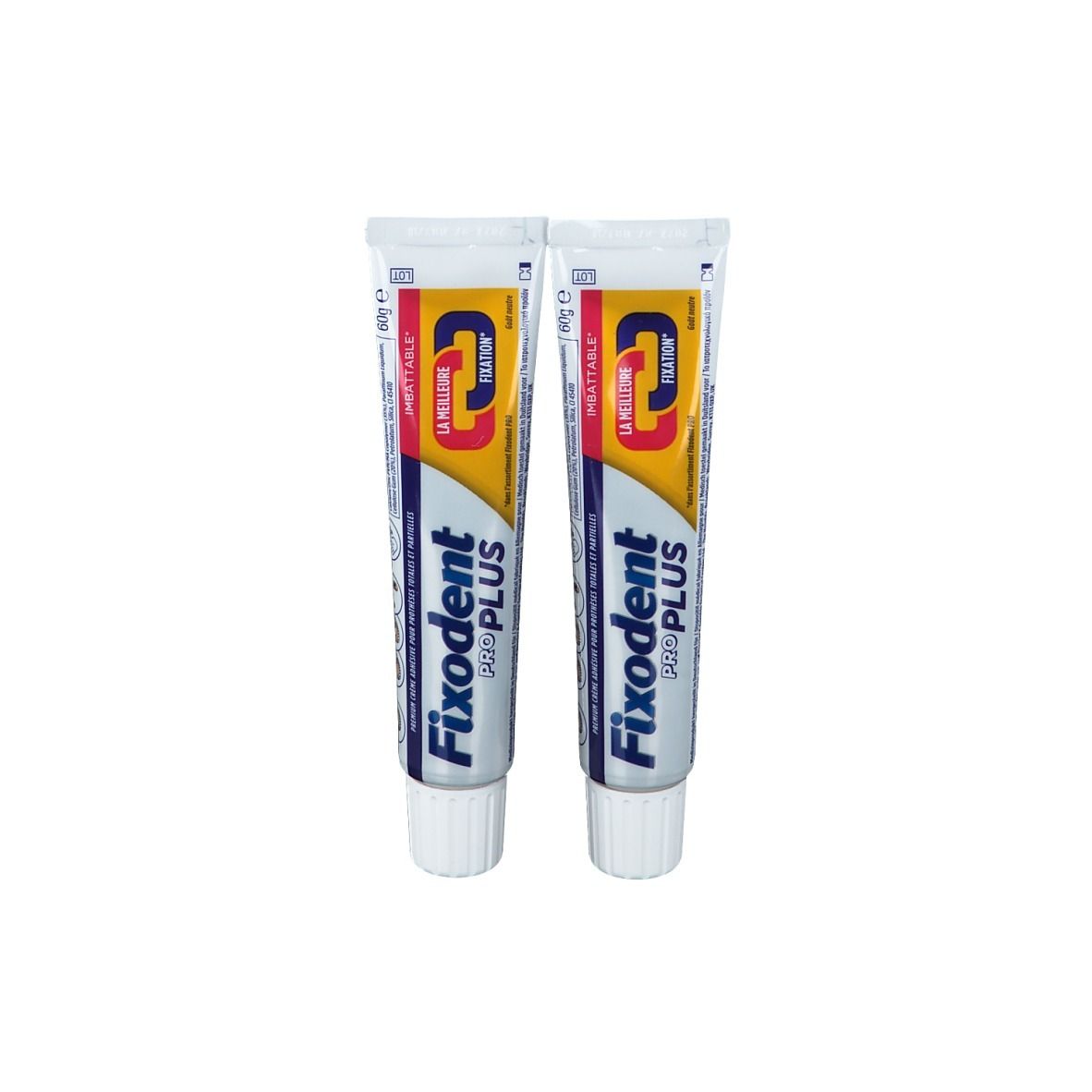 Deux tubes de crème adhésive Fixodent Pro Plus. Tubes blancs avec texte bleu et jaune. Nom du produit et logo clairement visibles.