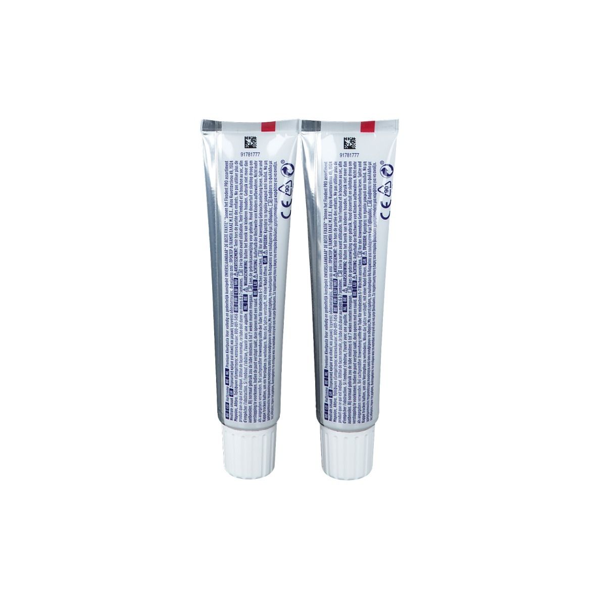 Dos de deux tubes de crème adhésive Fixodent Pro Plus. Tubes argentés avec texte et logos. Bouchons à vis blancs.