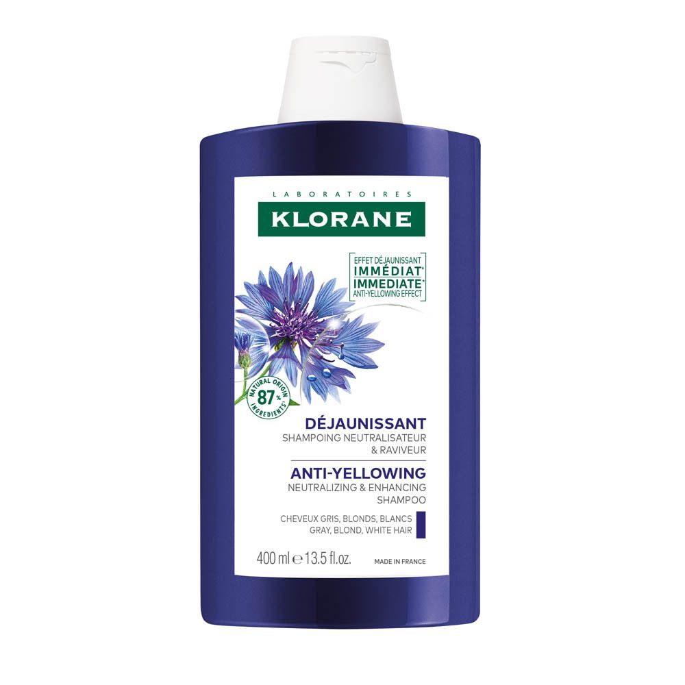 Paarse shampoo fles. Opschrift: Klorane, anti-vergeling shampoo. Bevat 87% ingrediënten van natuurlijke oorsprong.