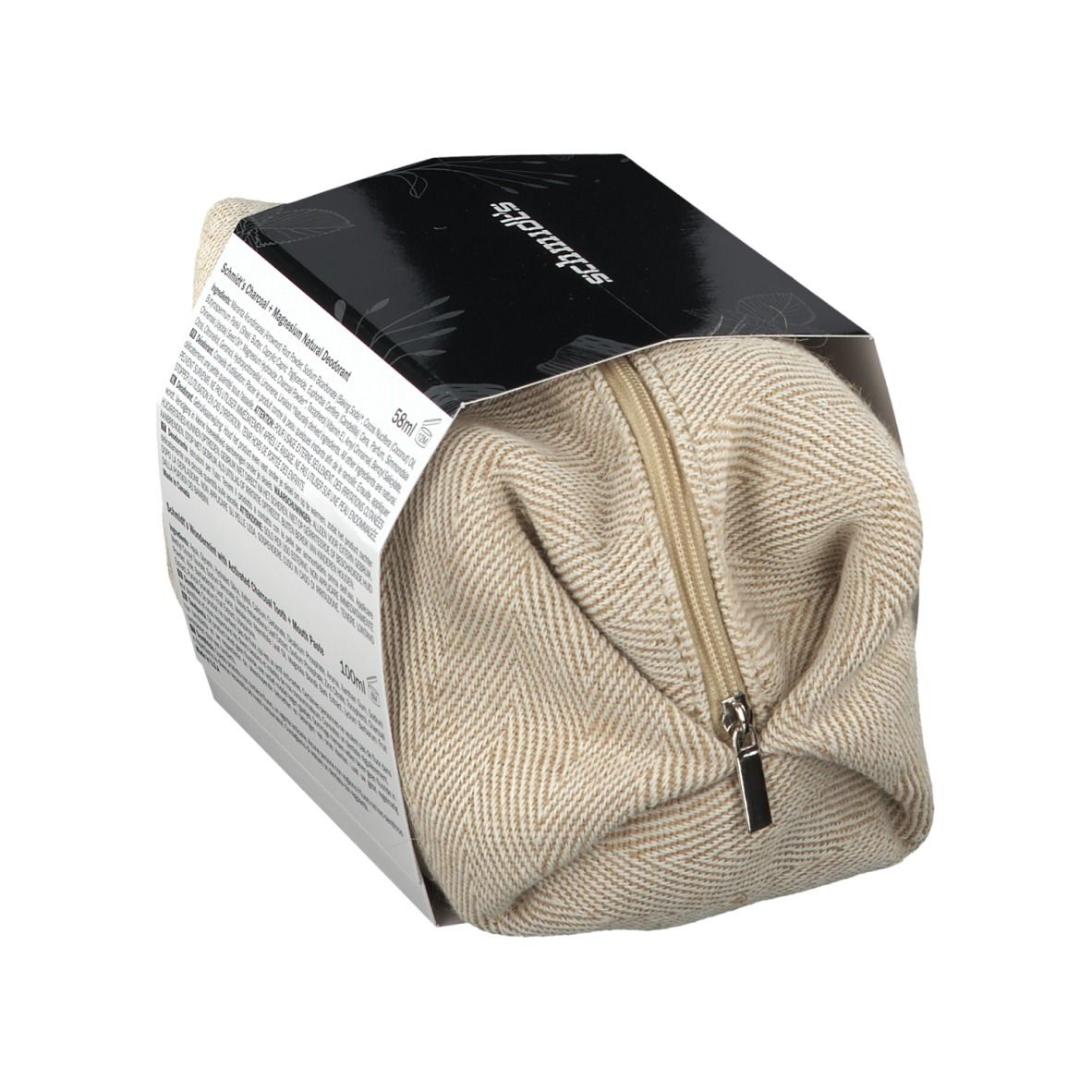 Geschenkset met actieve kool, gedeeltelijk geopend. Beige tas met ritssluiting. Zwarte verpakking met productnamen.