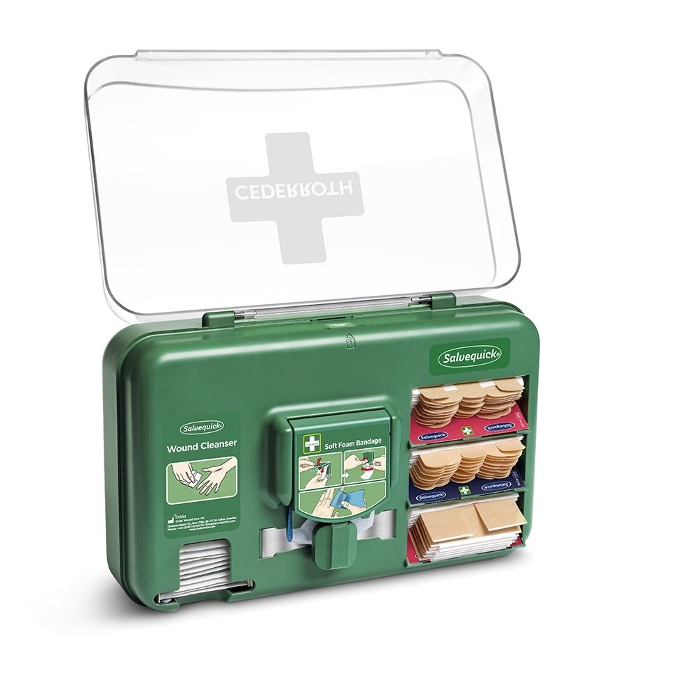 Distributeur Cederroth vert pour soins des plaies, couvercle ouvert, rempli de matériel de pansement.