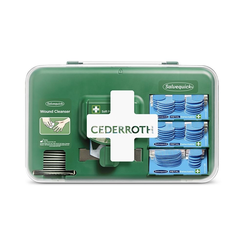 Groene Cederroth Wondzorg Dispenser met wit kruis, gevuld met pleisters en verbandmiddelen.