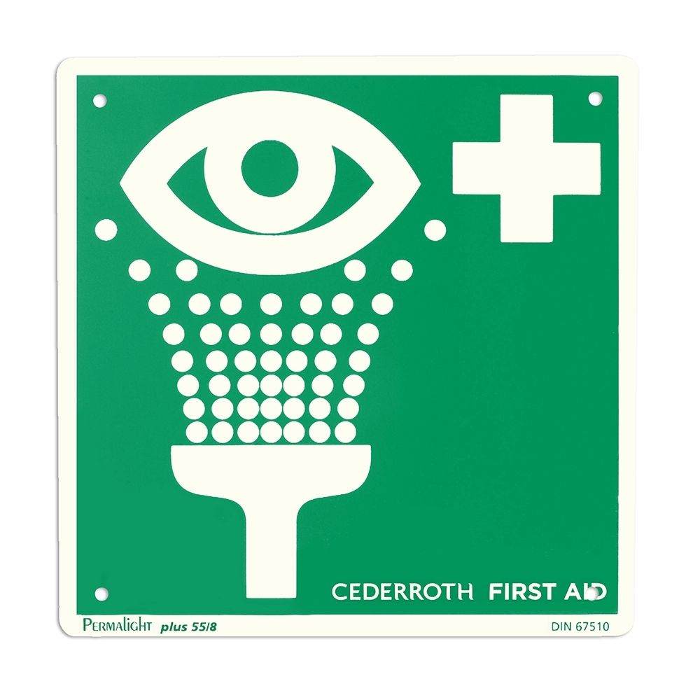 Plaque verte avec symbole blanc de lavage oculaire et croix blanche. Texte : CEDERROTH FIRST AID.
