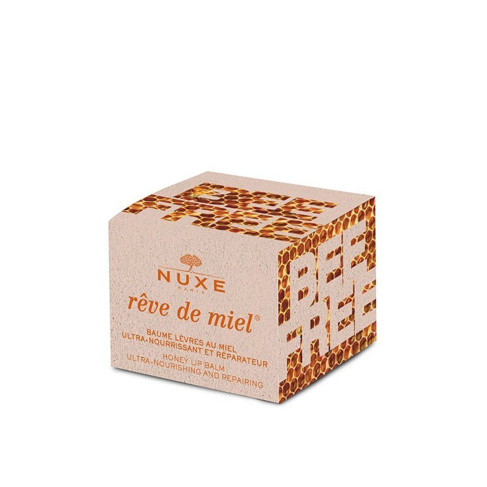 Nuxe Rêve de Miel lippenbalsem verpakking met honingraatpatroon en "Bee Free" tekst.