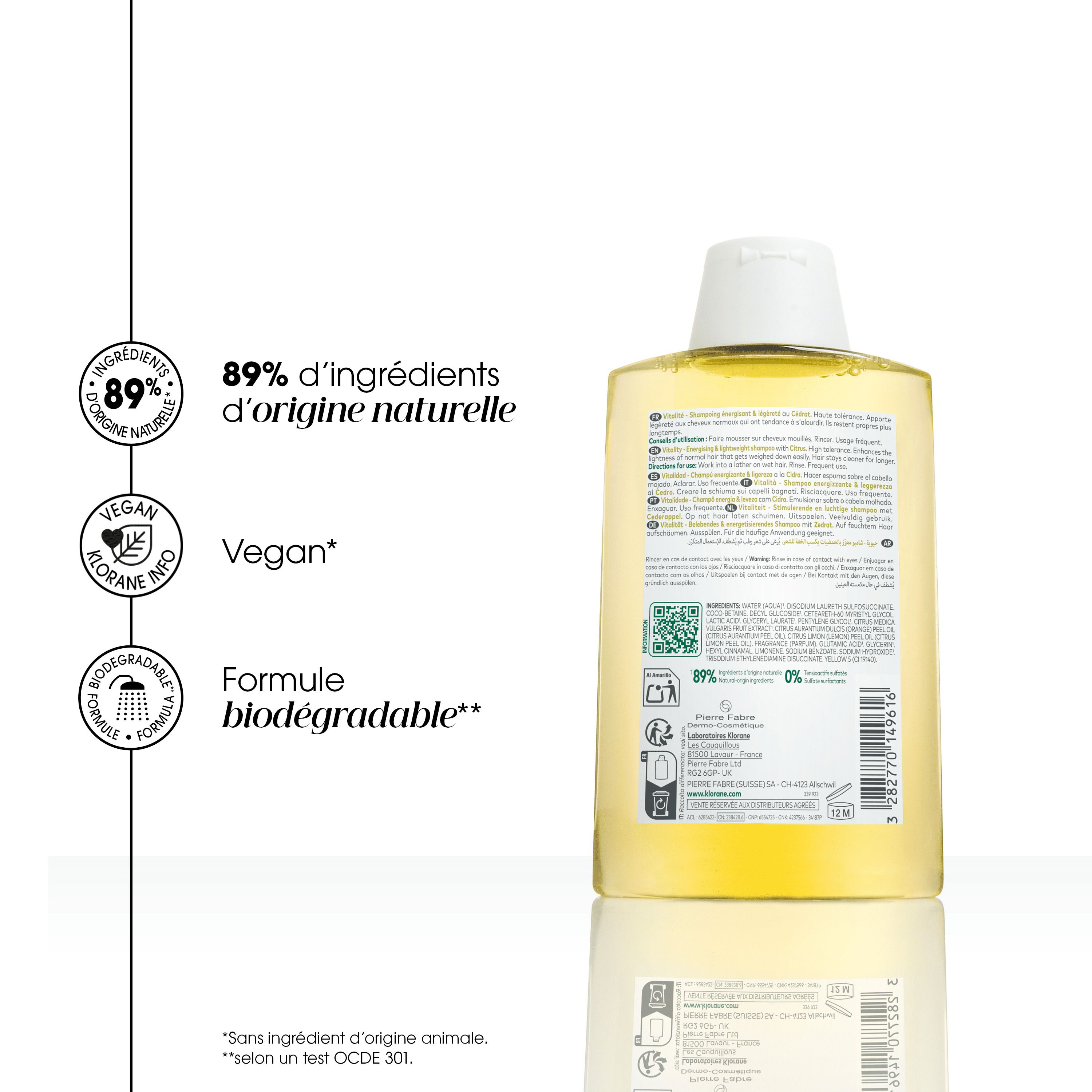 Vue latérale du flacon de shampooing KLORANE. Bouchon blanc. Liquide jaune.