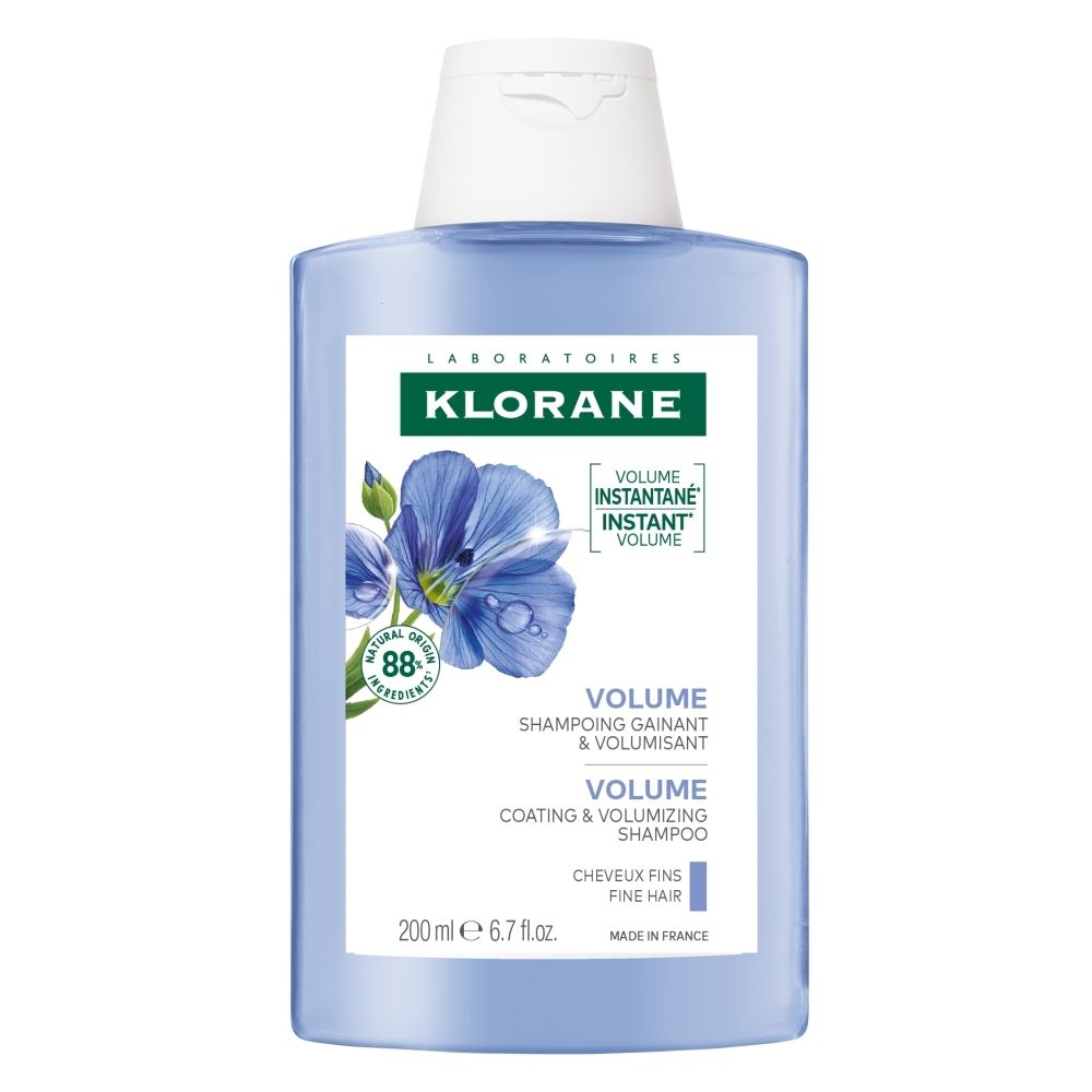 Klorane BIO Lijnzaad Volume Shampoo fles met illustratie van vlasbloemen en 88% natuurlijke ingrediënten.