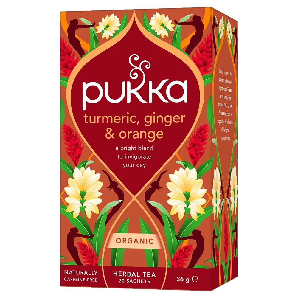 Pukka verpakking "turmeric, ginger & orange". Oranje design met bloemmotieven. Biologische kruidenthee.