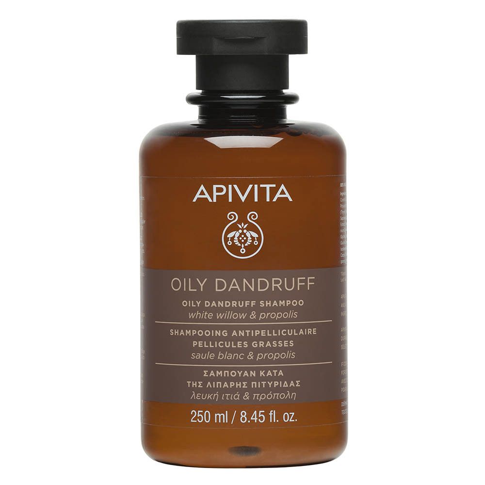 Bruine fles met zwarte dop. Opschrift: APIVITA, OILY DANDRUFF, 250 ml. Met bladeren.