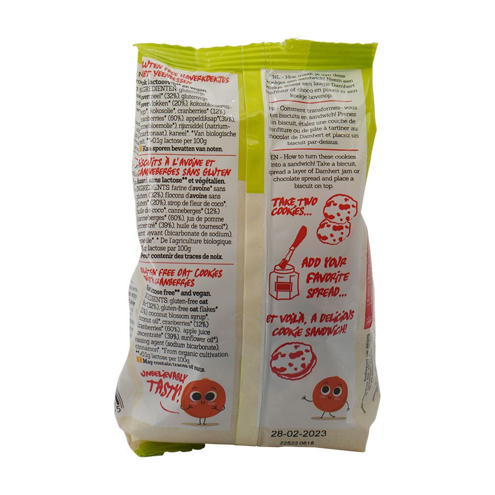 Achterkant van de koekjesverpakking. Meertalige tekst. Illustratie: koekjes met veenbessen. Instructies voor een sandwich.
