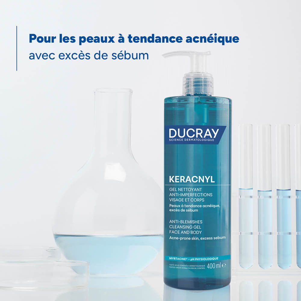 Flacon de produit et matériel de laboratoire. Inscription: KERACNYL Gel nettoyant, Ducray. Pour peau acnéique.