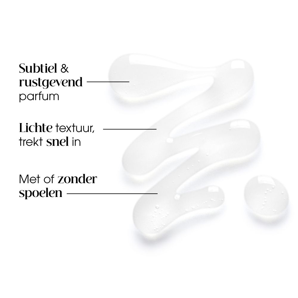 KLORANE Verzorgende spoeling Pioenroos: Roze tube met witte dop, pioenroosmotief en productinformatie aan de voorzijde.