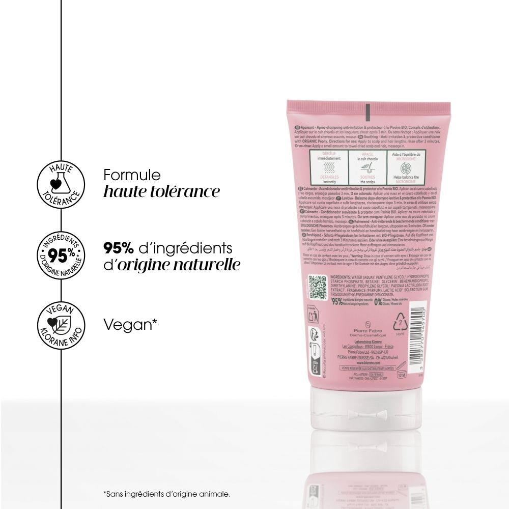 KLORANE Soin après-shampoing à la pivoine: Tube rose avec bouchon blanc, motif pivoine et informations produit à l'avant.