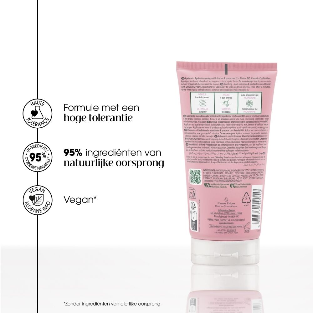 KLORANE Verzorgende spoeling Pioenroos: Roze tube met witte dop, pioenroosmotief en productinformatie aan de voorzijde.