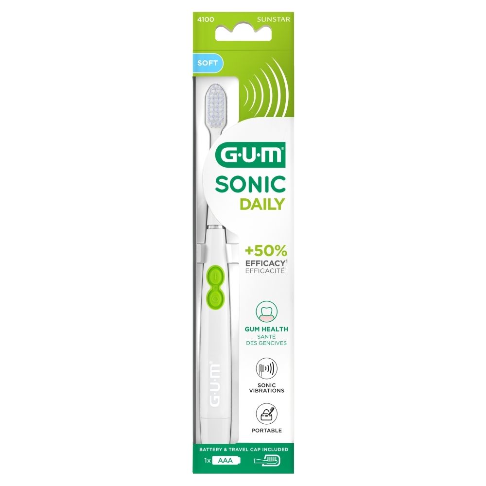Elektrische tandenborstel in verpakking. Witte behuizing, groene knoppen. G-U-M Sonic Daily.