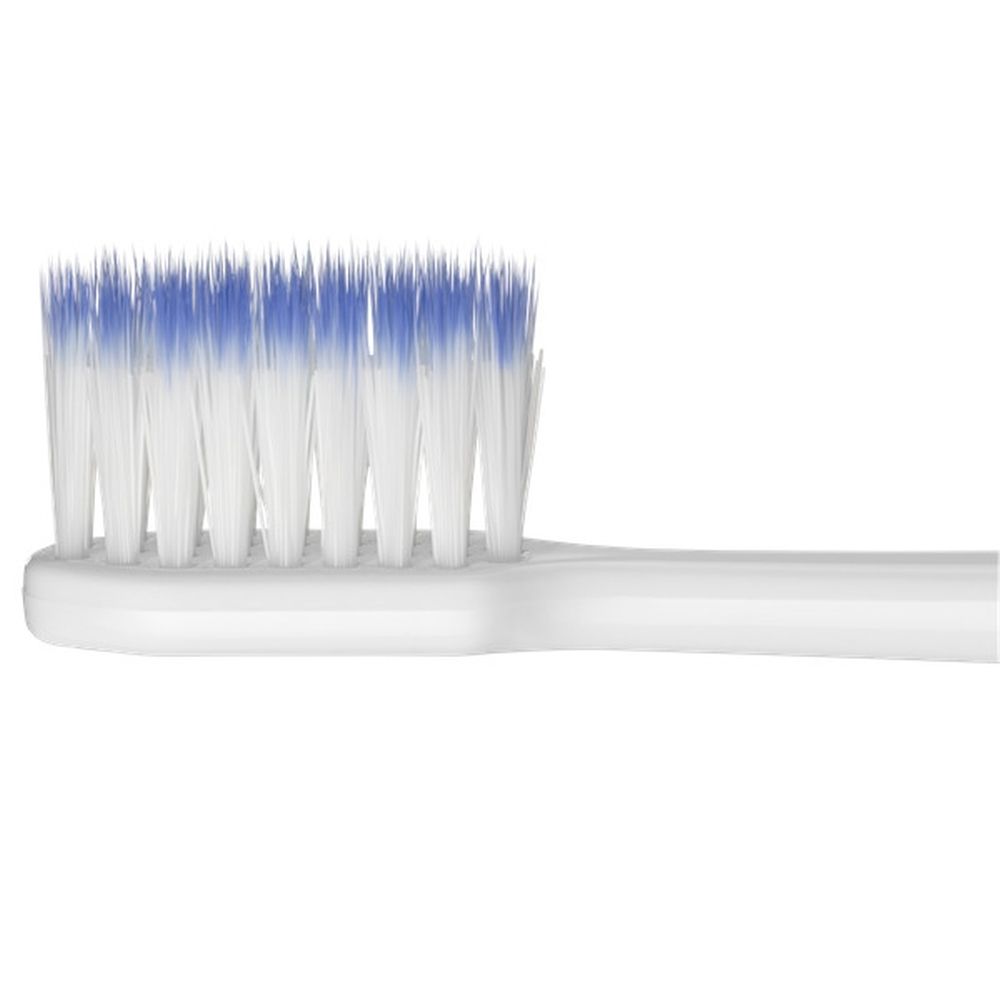 Elektrische tandenborstel in verpakking. Witte behuizing, groene knoppen. G-U-M Sonic Daily.