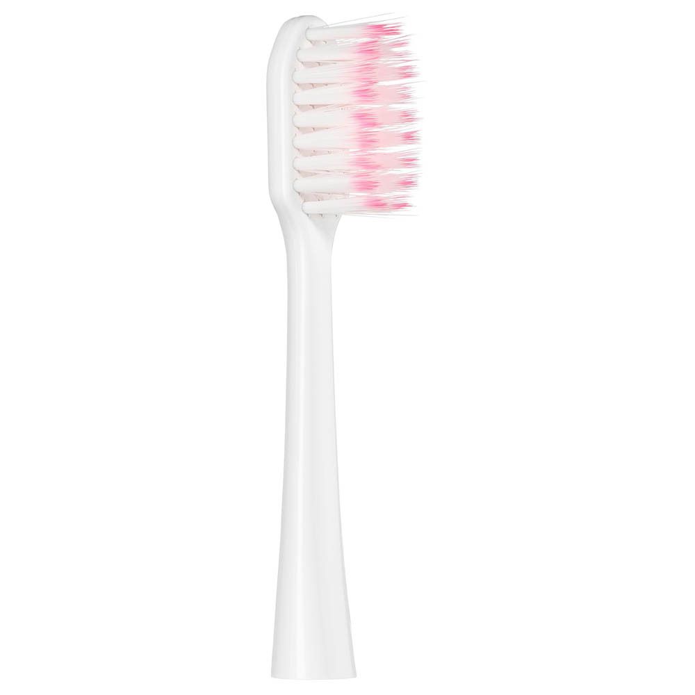 Gros plan d'une tête de brosse de rechange blanche avec des soies roses. La tête de brosse est destinée à une brosse à dents sonique.