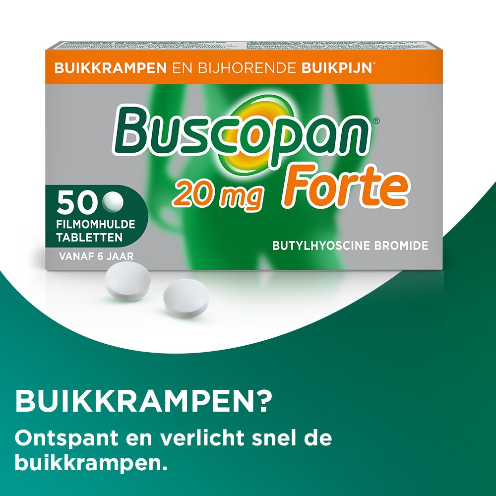 Twee tabletten Buscopan Forte 20 mg. Witte tabletten op groene achtergrond.