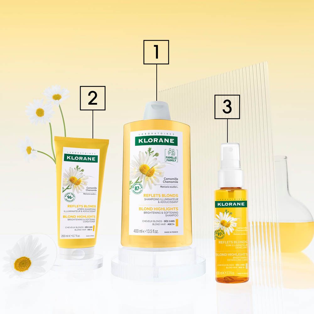 Flacon jaune avec vaporisateur. Inscription : KLORANE, spray à la camomille. 97% ingrédients naturels. 100 ml.