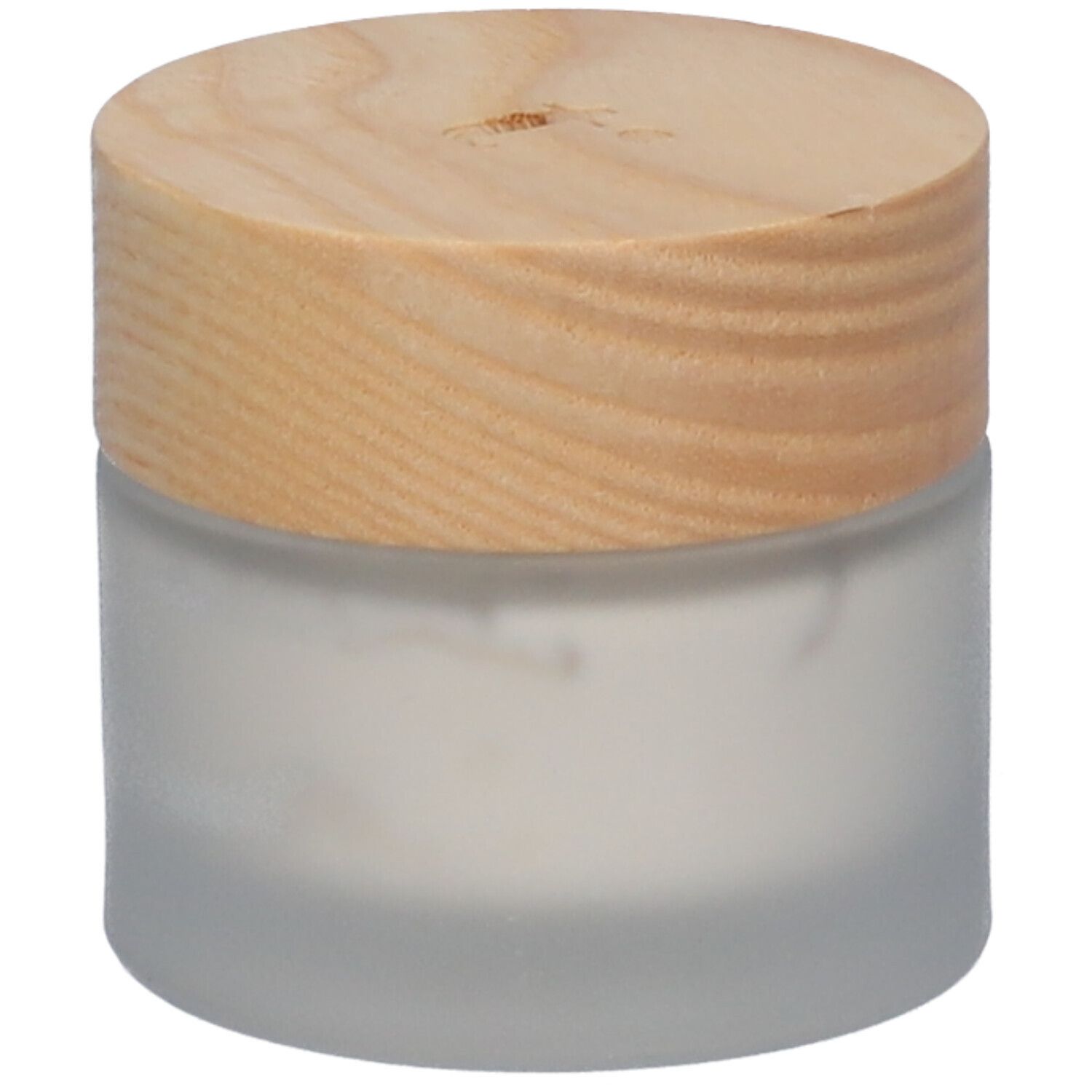 Crème anti-rougeurs Tinge dans un pot en verre avec couvercle en bois.