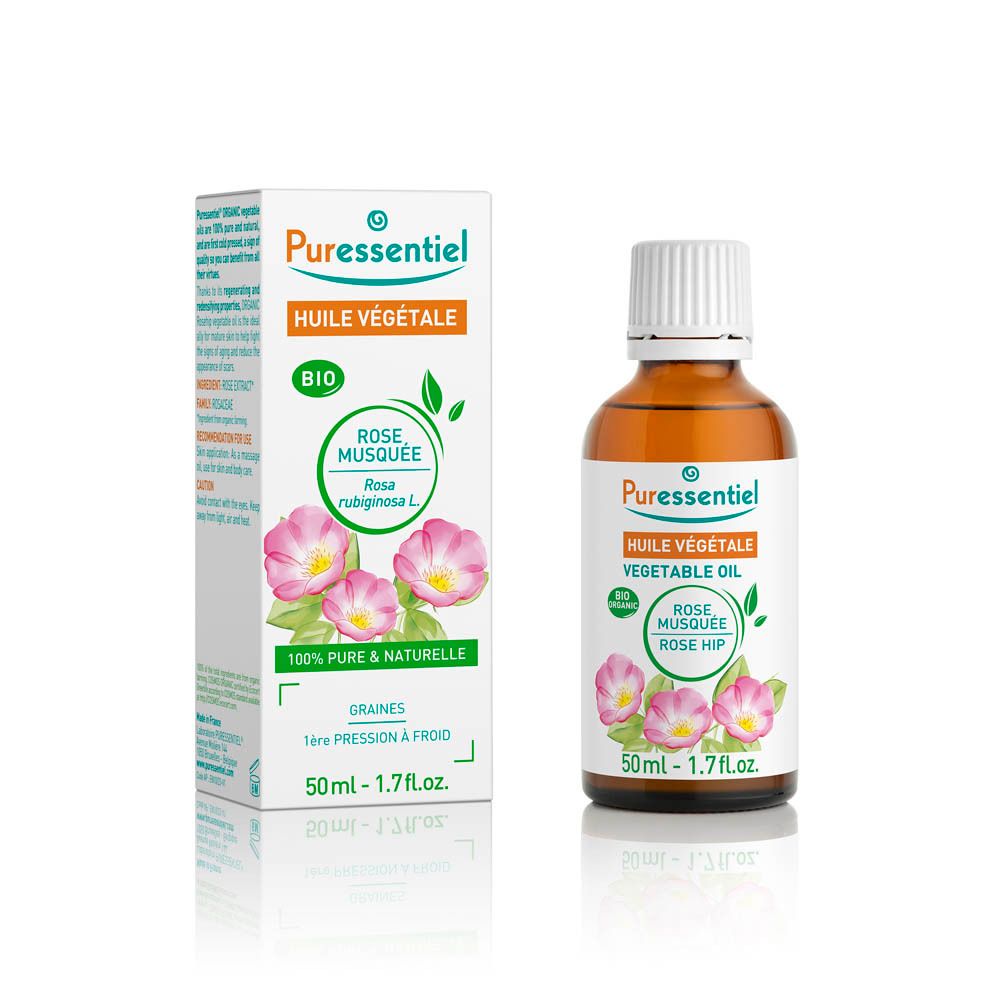 Productverpakking en fles. Witte doos met productnaam, rozenafbeelding en bio-label. Bruine glazen fles met witte dop.
