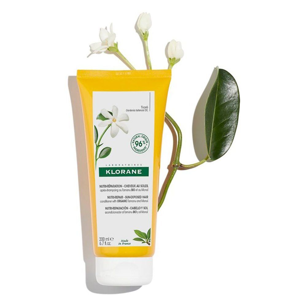 Tube jaune avec étiquette blanche et branche fleurie. Logo Klorane, nom du produit, ingrédients et 96% d'ingrédients naturels. Inscription en français.