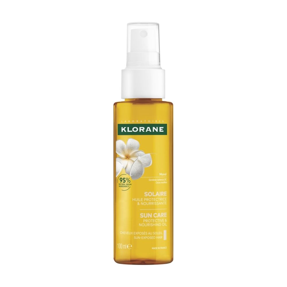 Huile Klorane pour cheveux, flacon spray 100ml, avec fleurs et feuilles.