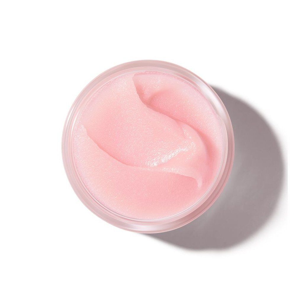 Nuxe lippenbalsem: glazen pot met roze deksel, etiket met Nederlandse tekst.