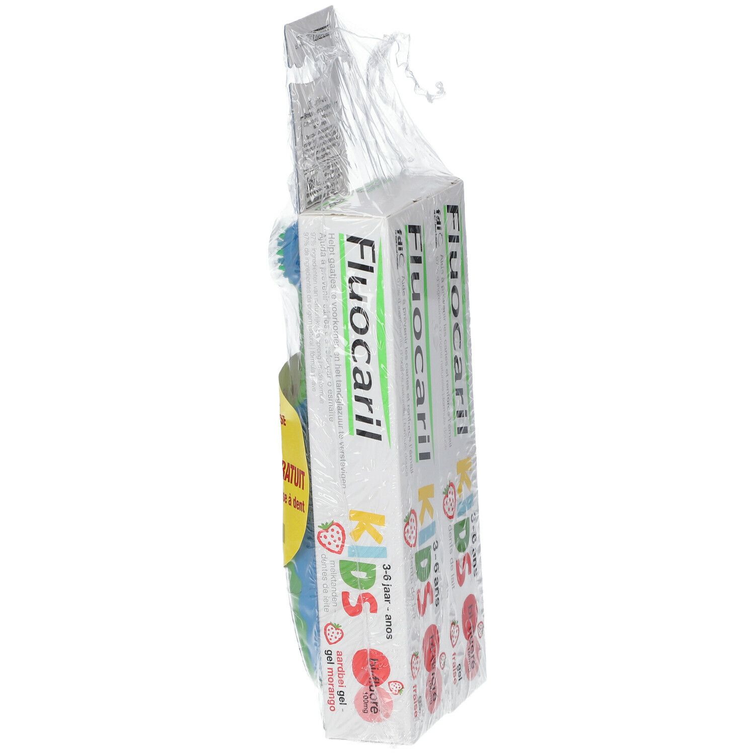 Emballage avec dentifrice et brosse à dents. Nom du produit sur l'emballage, autocollant jaune.