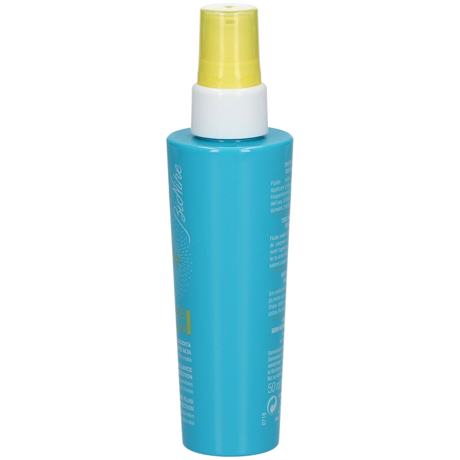 Turquoise fles met gele spraykop. Opschrift: Bionike, 50+, Defence Sun.