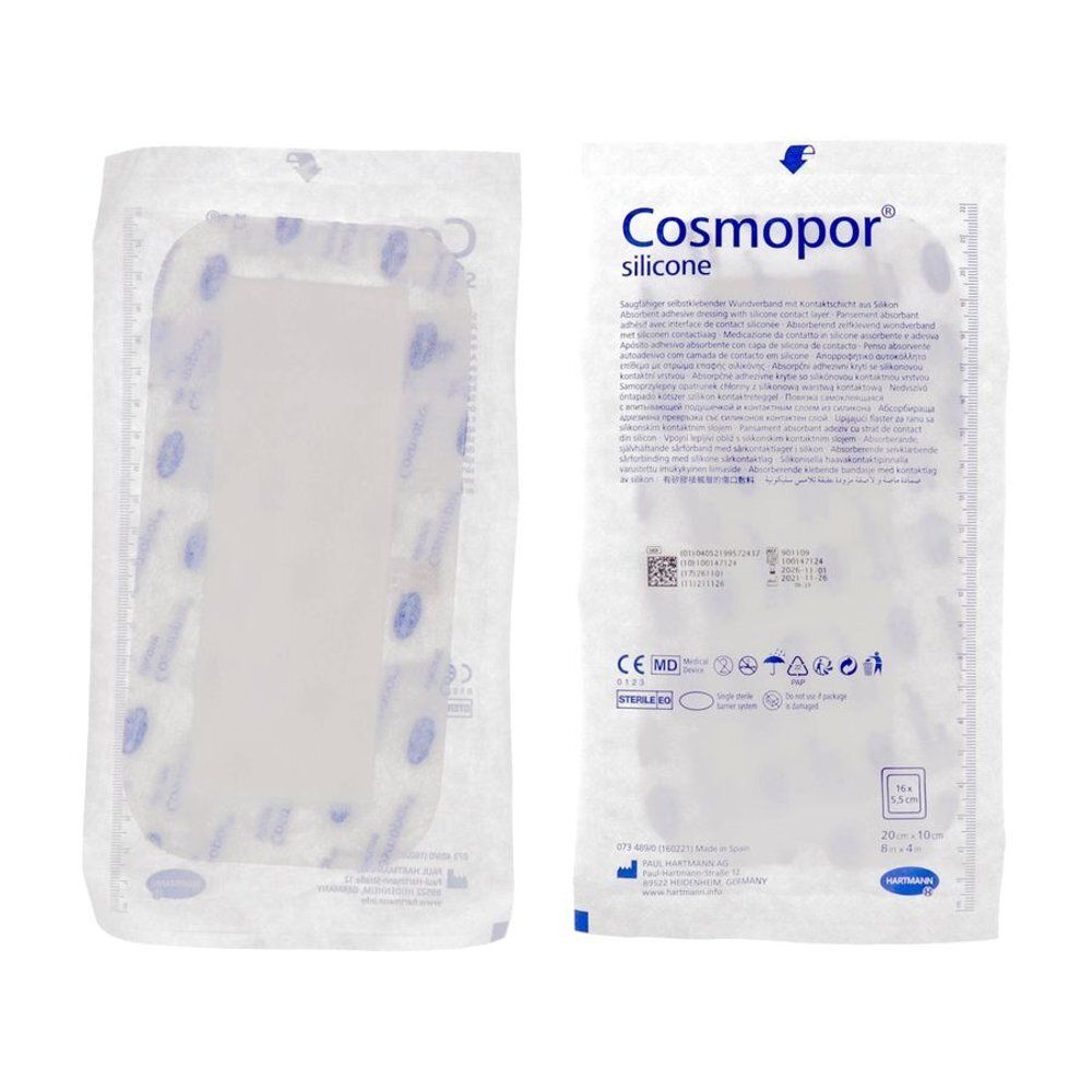 Emballage Cosmopor Silicone. Pansement rectangulaire stérile, bordures bleues. Informations produit au dos.