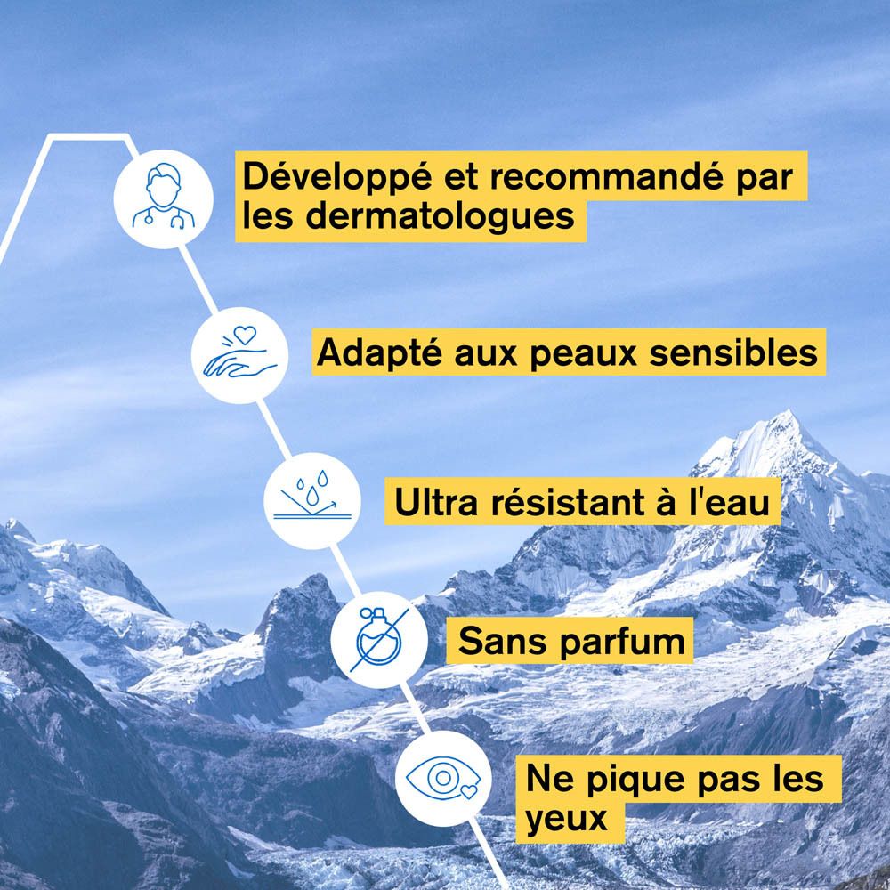 Dos du flacon jaune avec texte. URIAGE Eau Thermale Bariésun Spray SPF50. Vaporisateur blanc.