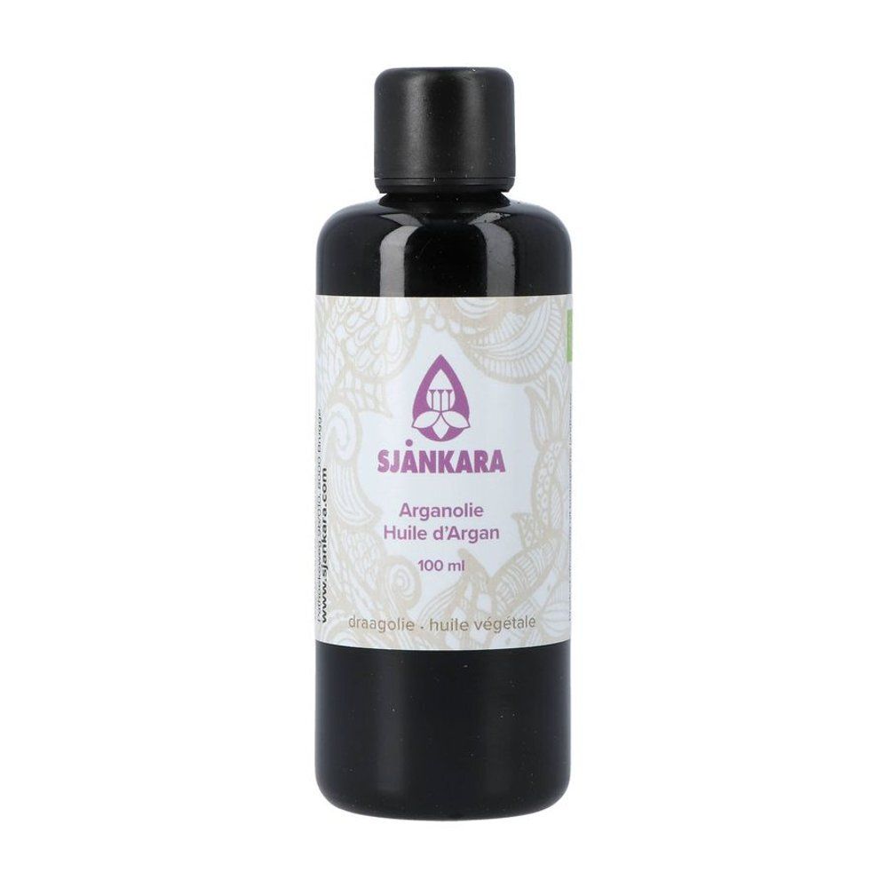 Productfles met zwarte dop. Etiket met logo en productinformatie. Arganolie Huile d'Argan. 100 ml.