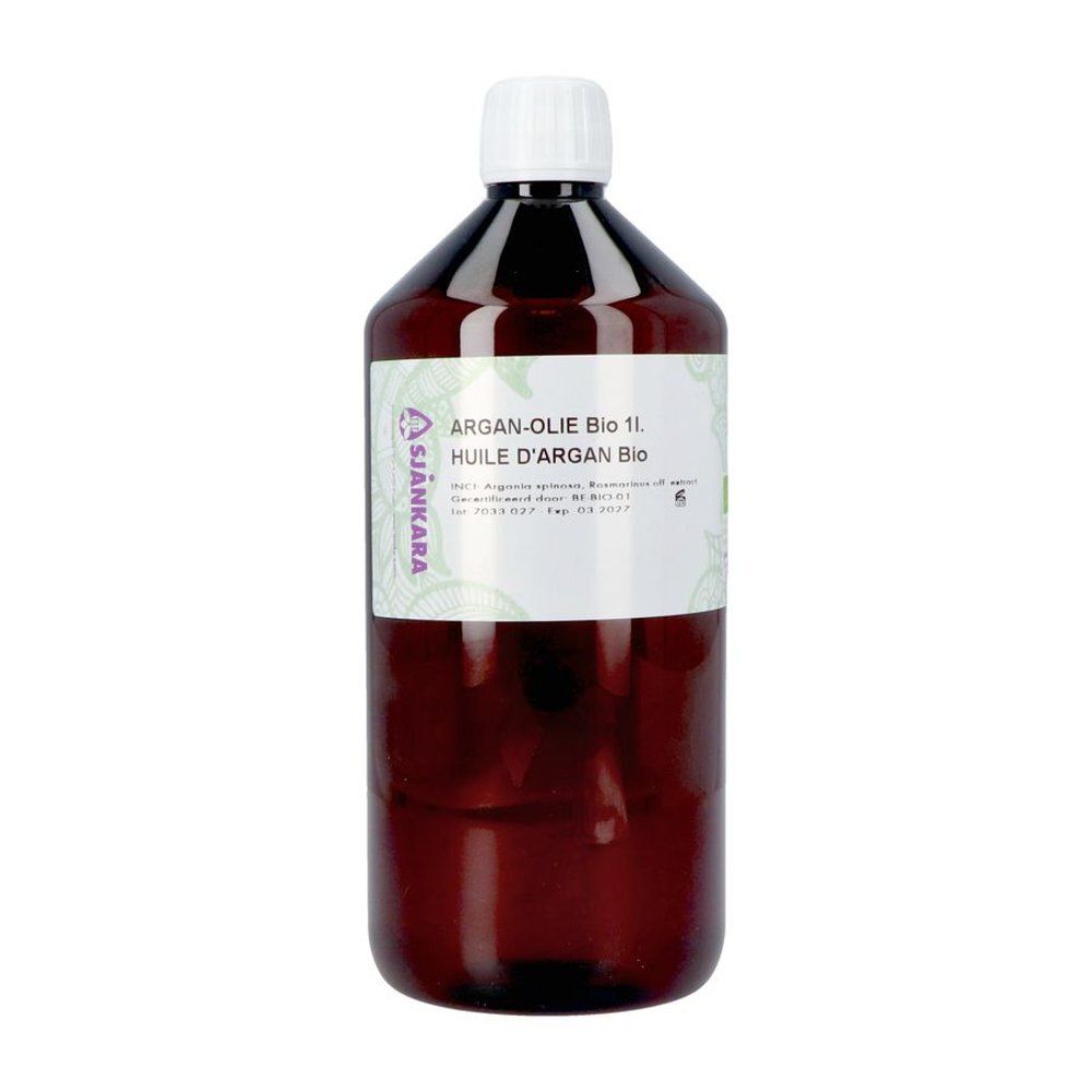 Flacon brun avec bouchon blanc. Étiquette avec texte: Argan-Olie Bio 1L, Huile d'Argan Bio. Marque Shankara.