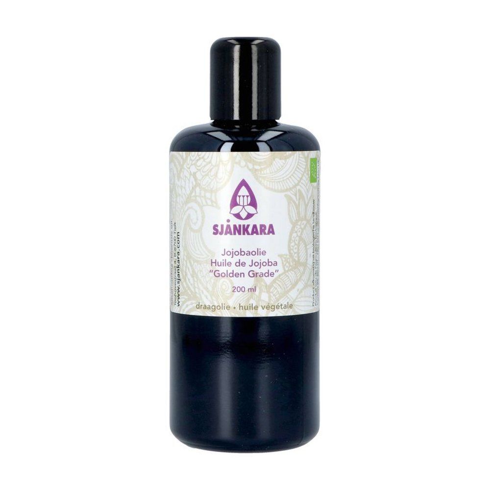 Zwarte fles met zwarte dop. Etiket met productnaam, merk en bio-keurmerk. Inhoud: jojoba-olie.